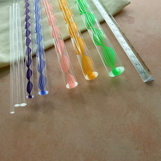 Dotting and Pressing Set acrylic rods fanned out showing graduating sizes with purple blue pink orange and green spiral patterns