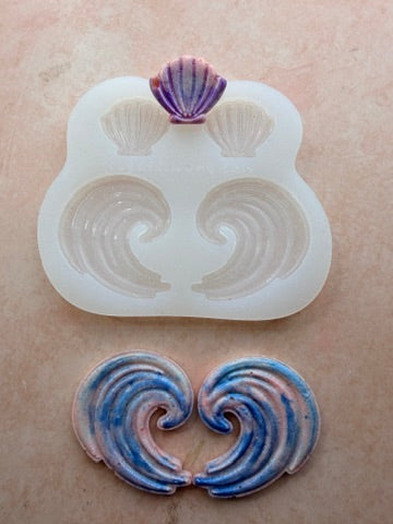 Shells and Swells silicone mold for polymer clay showing all four cavities with finished wave and shell earring pieces