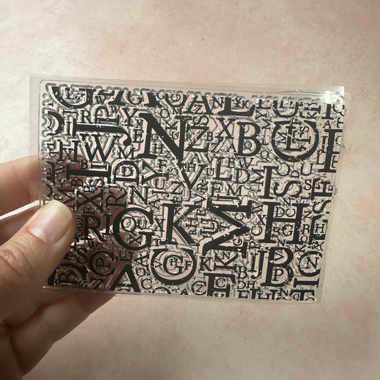 Letters grunge background clear clay and paper rubber stamp